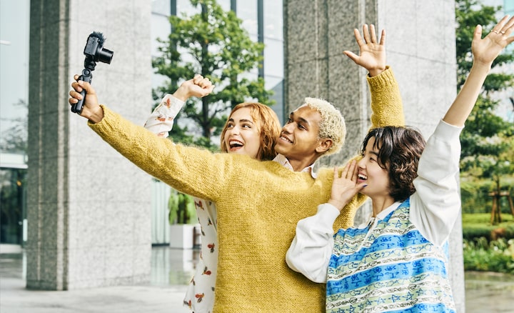 Image of three models shooting selfie