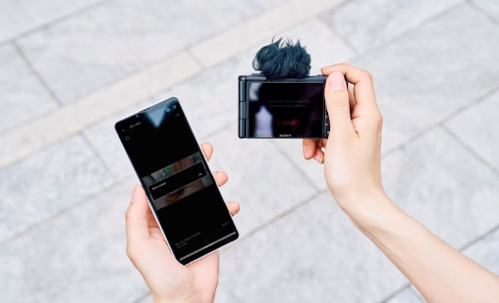 Image in which a person transferring the data from camera to a smartphone